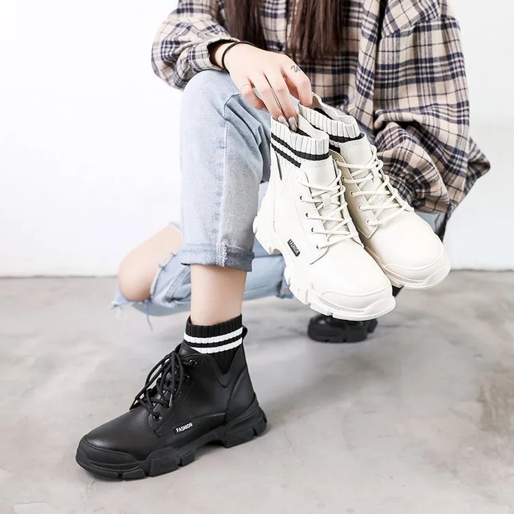 Women's short Martin boots in black faux PU leather with decorative stitching and lace-up front