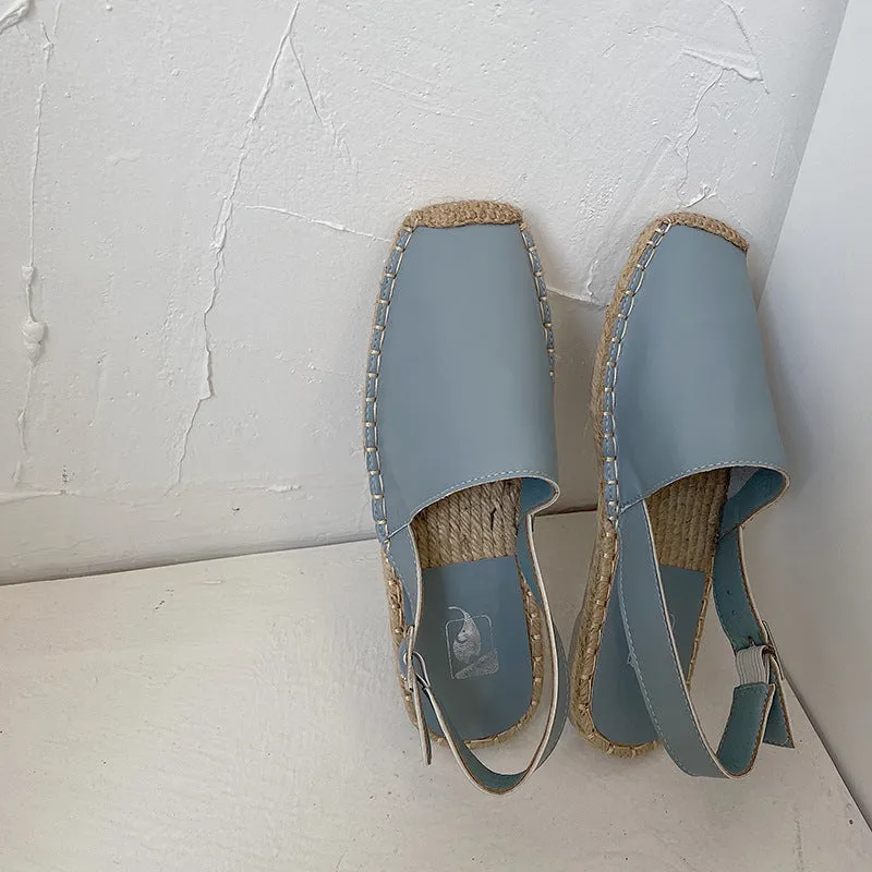 Women's beige retro fisherman flat sandals with canvas upper on a neutral background.