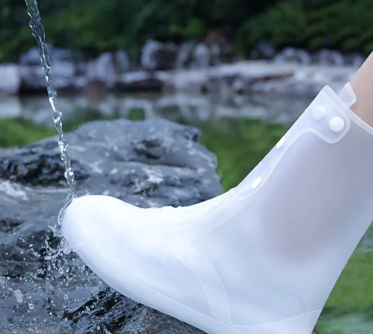 White high-top PVC reusable shoe covers for women on a rainy day background.