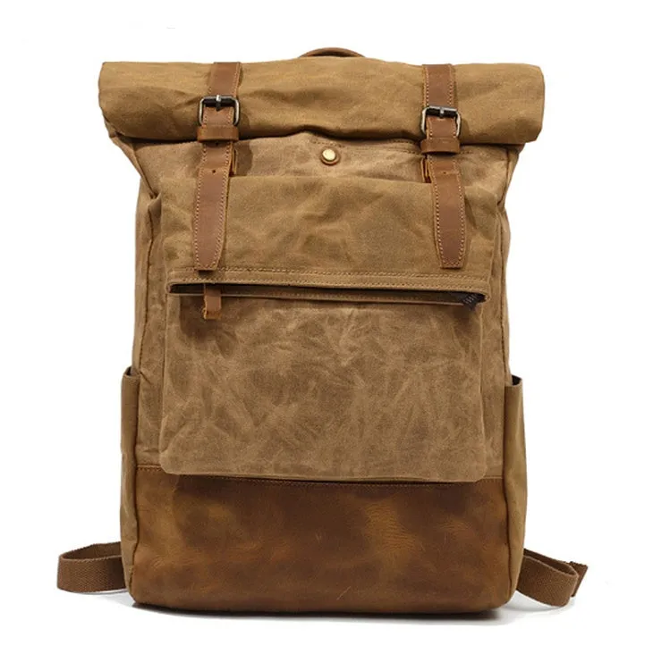 Canvas vintage backpack in khaki showing front zipper pocket and curved shoulder straps with retro square shape