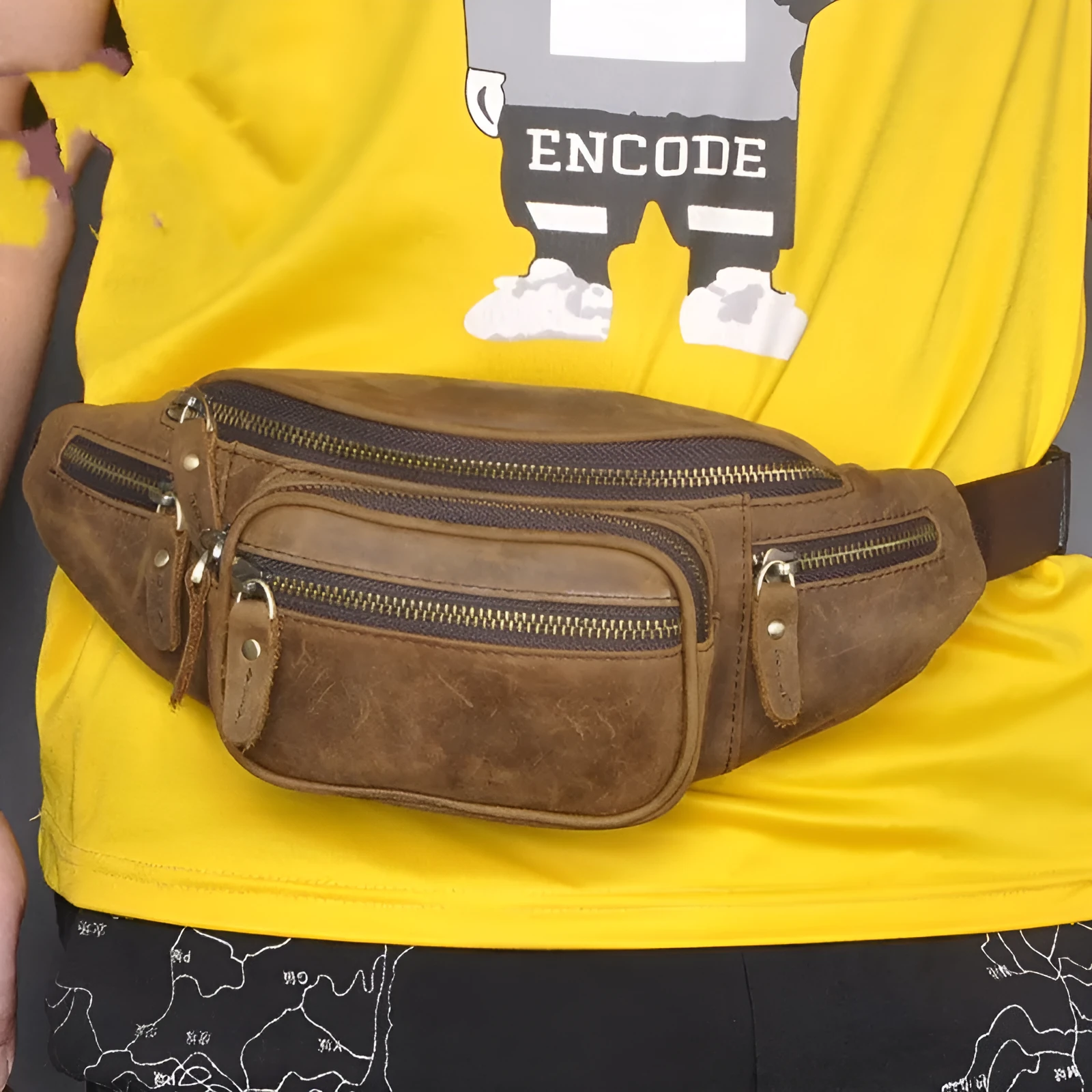 Brown leather shoulder messenger bag with single strap showing interior polyester cotton lining