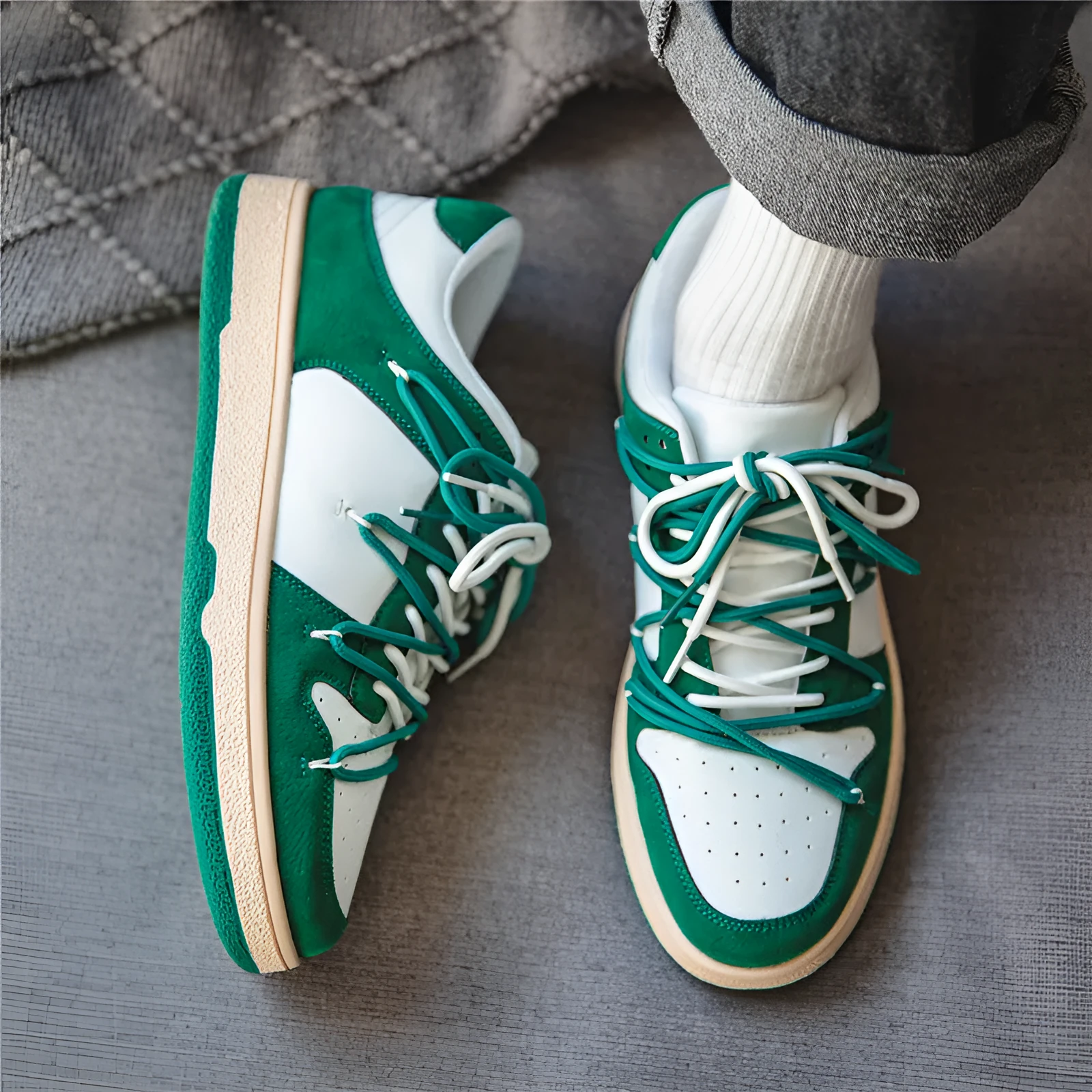 Men's low-top lace-up sneaker in beige with height increase, microfiber upper, and rubber sole on flat surface