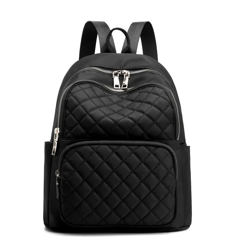 Women nylon embossed casual backpack in blue with zippered closure and soft handle