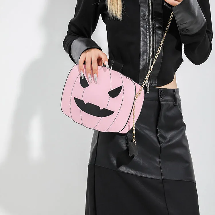 Cartoon pumpkin shoulder bag in orange with chain strap on white background