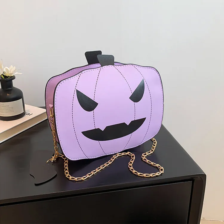 Cartoon pumpkin shoulder bag in orange with chain strap on white background