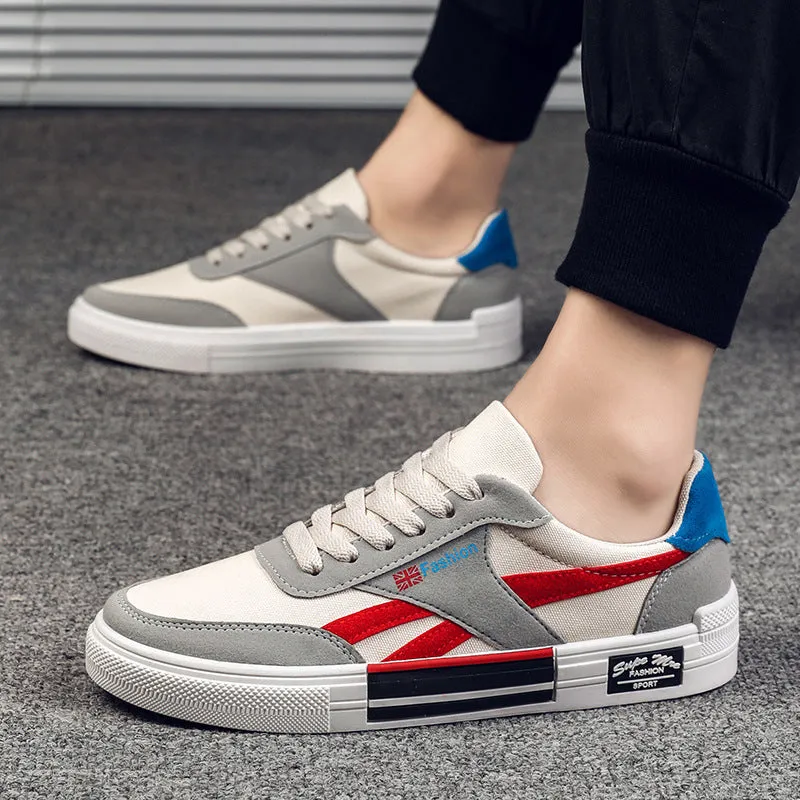 Men's canvas sneakers in black with rubber sole, round toe, and front tie lace closure.