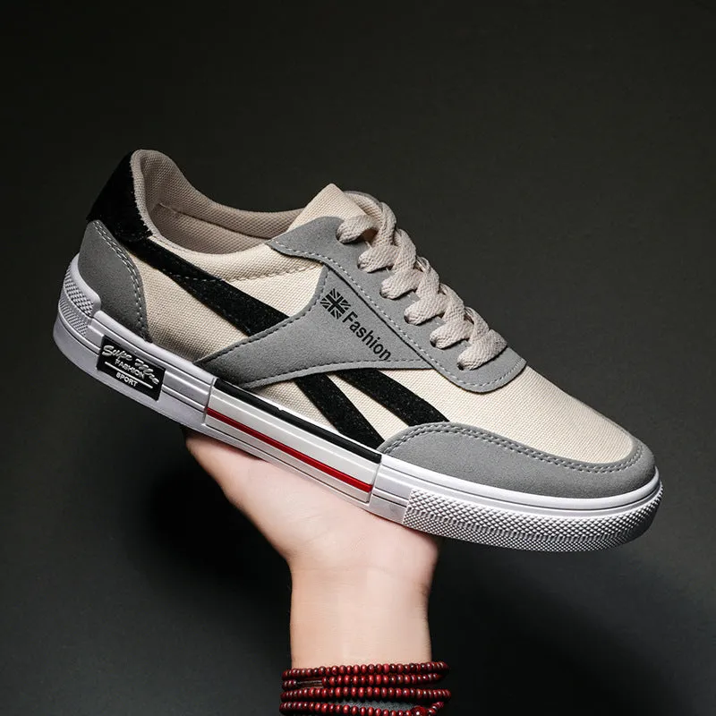 Men's canvas sneakers in black with rubber sole, round toe, and front tie lace closure.