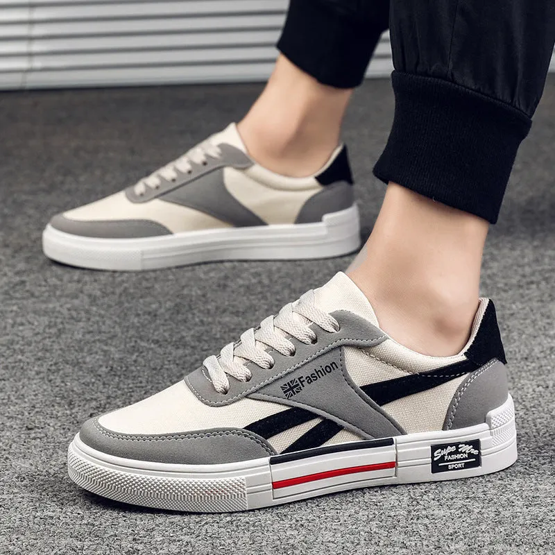 Men's canvas sneakers in black with rubber sole, round toe, and front tie lace closure.