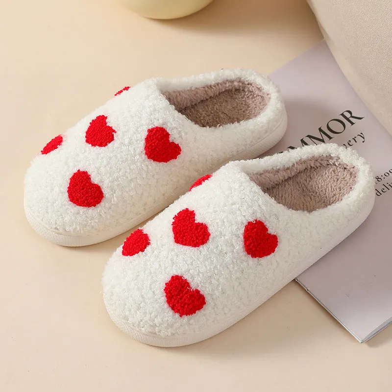 Women's plush cartoon-style home slippers with a round toe and PVC sole.