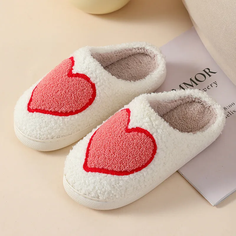 Women's plush cartoon-style home slippers with a round toe and PVC sole.
