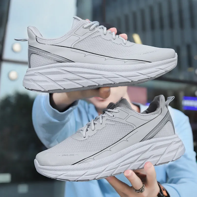 Men's black thick-soled anti-skid lace-up running sneakers with round toe and rubber sole on grey background