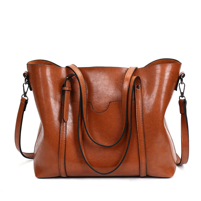 Retro-style brown PU messenger bag for women, shown with an A4 magazine inside to demonstrate capacity.