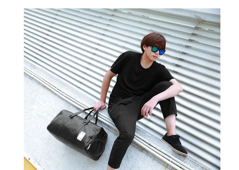Black waterproof sports bag with separate side shoe compartments and diagonal shoulder straps