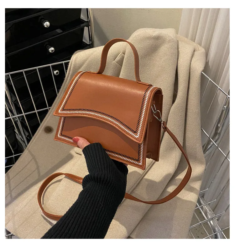 Urban simple PU crossbody flap bag with sewing line detail available in black, brown, and white