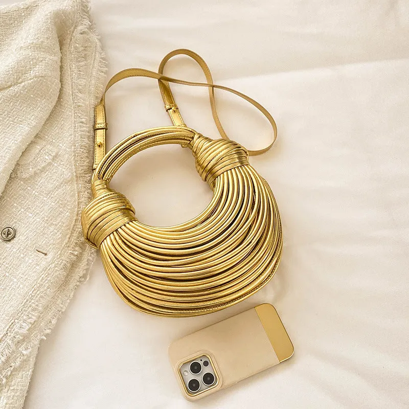 Instafamous Metal Noodles Underarm Bag with shiny metallic surface, chain detail, in gold colour
