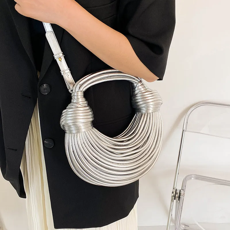 Instafamous Metal Noodles Underarm Bag with shiny metallic surface, chain detail, in gold colour