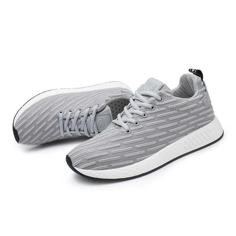 Men Malcolm Sneaker in black from side view showing mesh fabric upper and low-top design