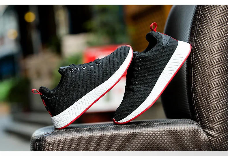 Men Malcolm Sneaker in black from side view showing mesh fabric upper and low-top design