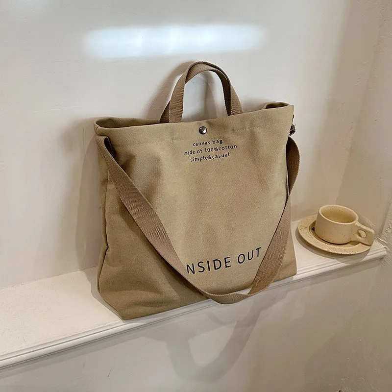Large-capacity canvas tote bag with alphabet print and adjustable strap in coffee colour