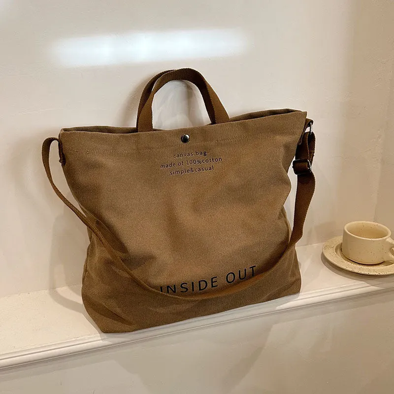 Large-capacity canvas tote bag with alphabet print and adjustable strap in coffee colour