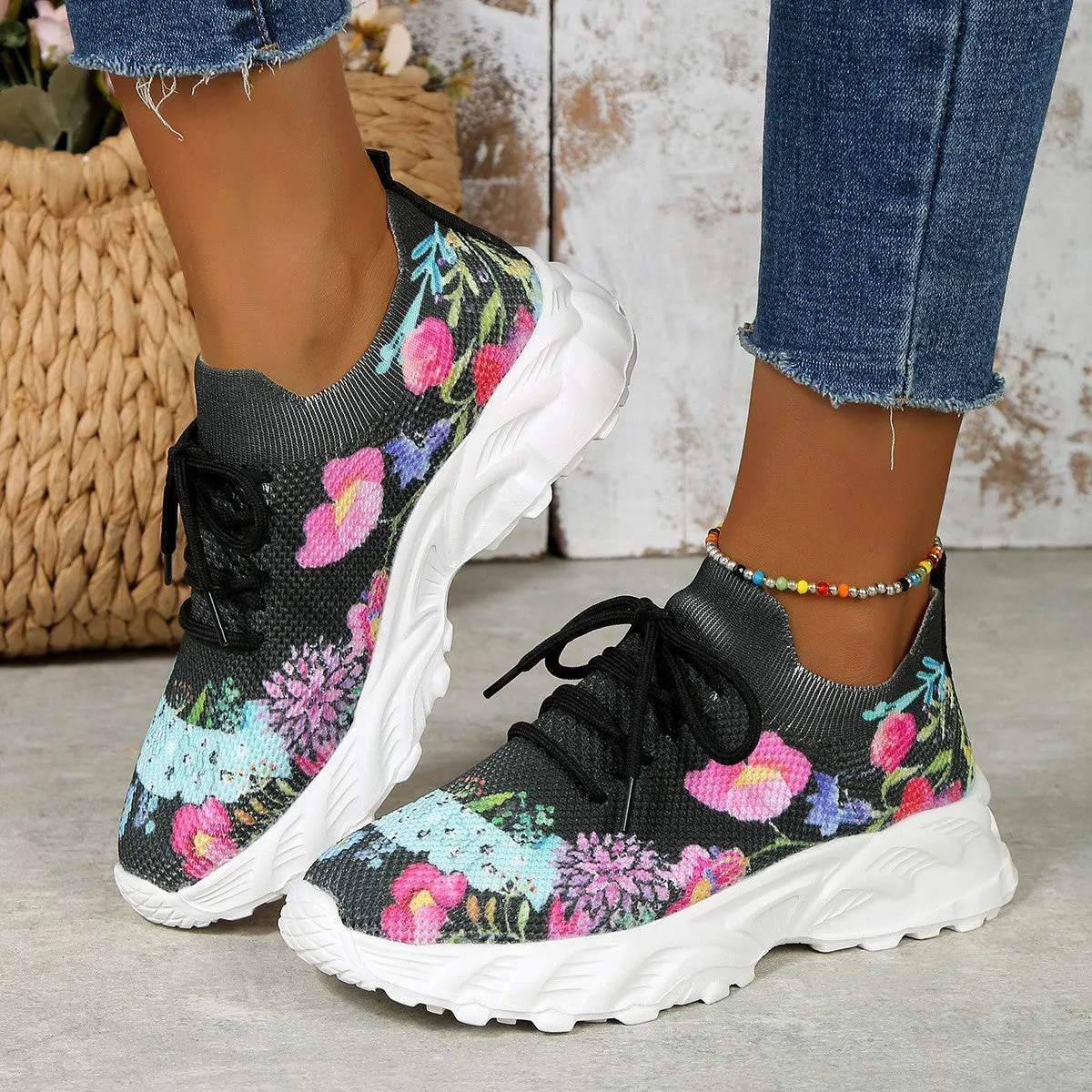 Women's floral print canvas walking sneakers with lace-up closure and rubber sole in pink