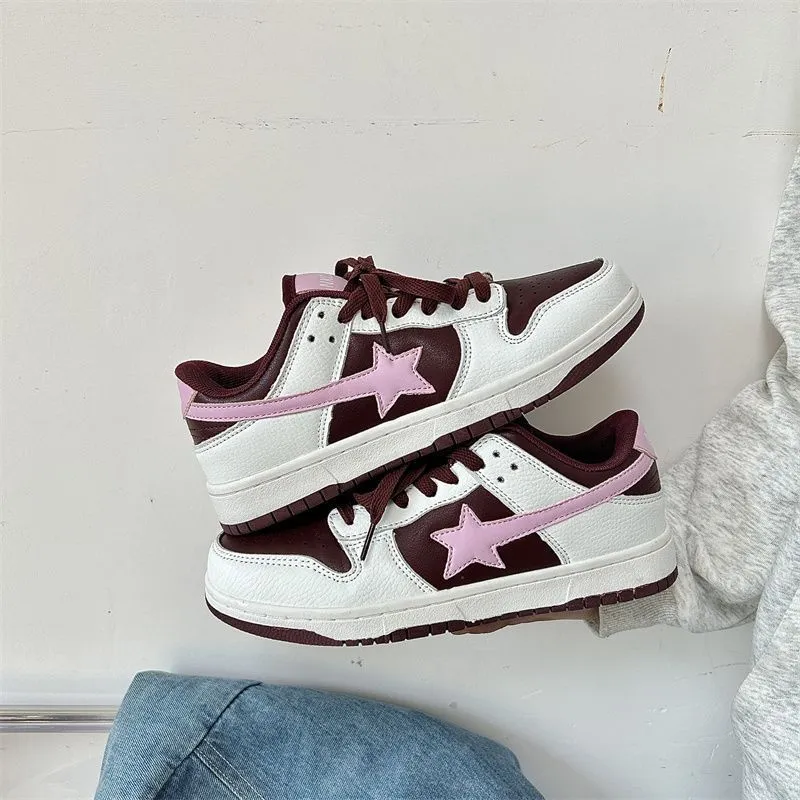 Lightweight lace-up low top sneakers with polyurethane upper and cloth lining in white and black colourway