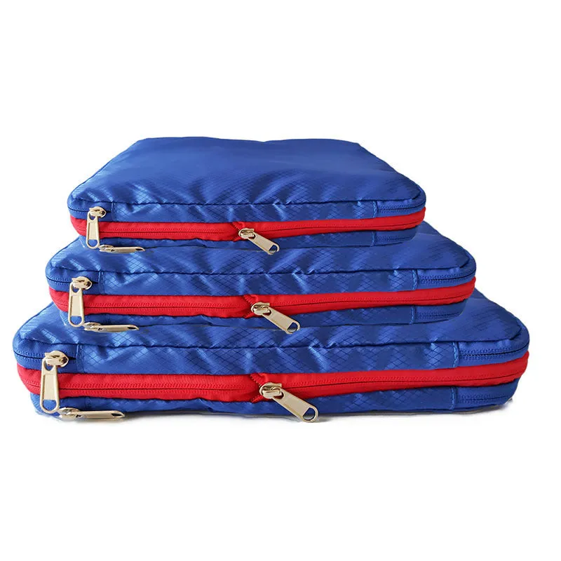 Waterproof nylon travel compression storage bag in cube shape, available in green, blue, black, and grey