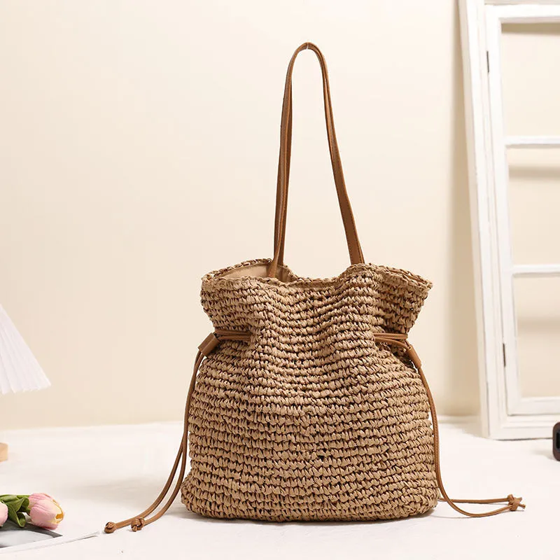 Large capacity paper straw drawstring shoulder bag in beige with double straps and inner pocket