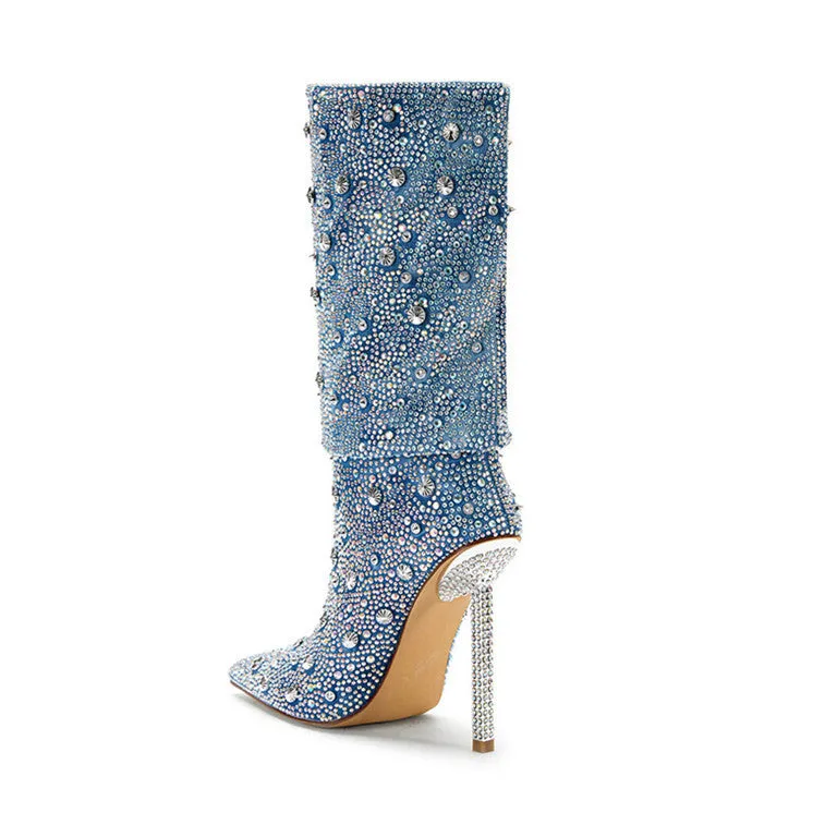 Women's blue denim pointed toe heel boots with stretchy fit on a plain background