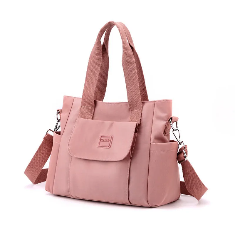 Women's large capacity multi-interlayer shoulder bag in nylon, soft horizontal square shape with sewing line detail, multiple internal compartments, urban simplicity style