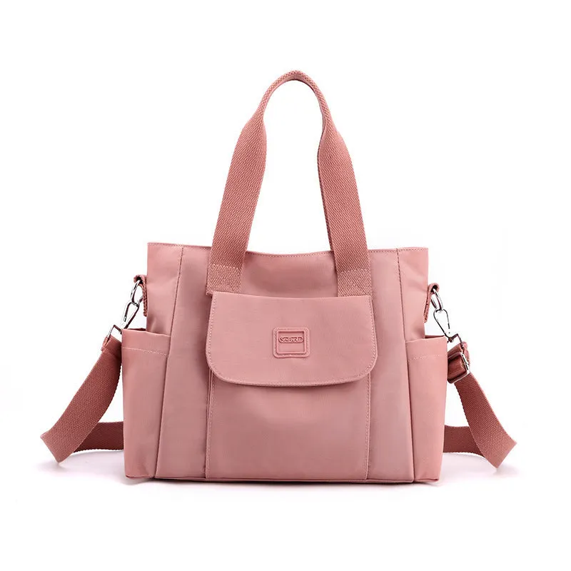 Women's large capacity multi-interlayer shoulder bag in nylon, soft horizontal square shape with sewing line detail, multiple internal compartments, urban simplicity style