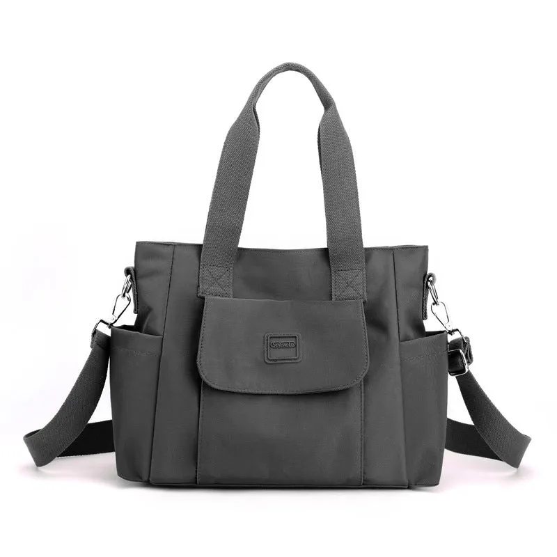 Women's large capacity multi-interlayer shoulder bag in nylon, soft horizontal square shape with sewing line detail, multiple internal compartments, urban simplicity style