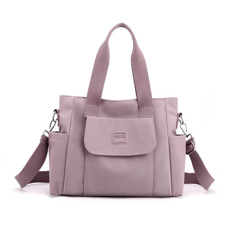 Women's large capacity multi-interlayer shoulder bag in nylon, soft horizontal square shape with sewing line detail, multiple internal compartments, urban simplicity style