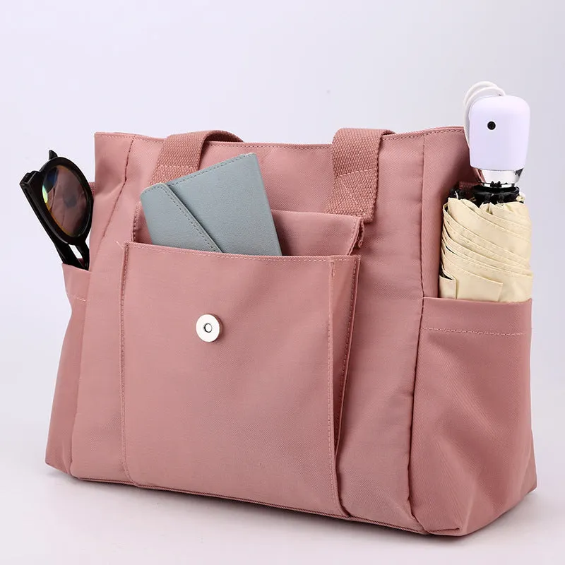 Women's large capacity multi-interlayer shoulder bag in nylon, soft horizontal square shape with sewing line detail, multiple internal compartments, urban simplicity style