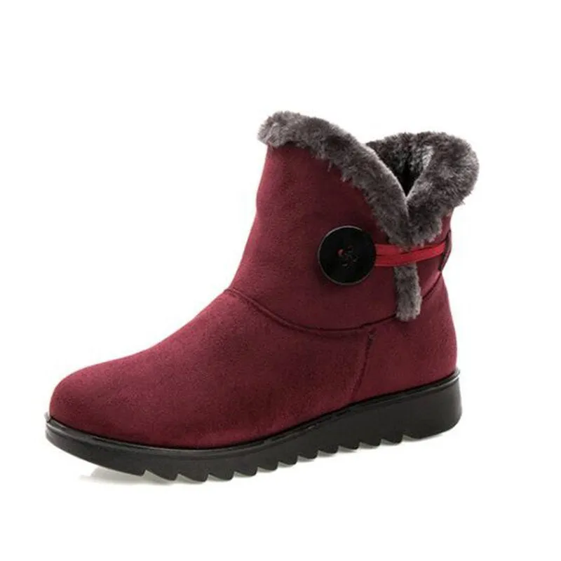 Women's winter flock ankle snow boots with button closure, rubber sole, and low platform in solid colour