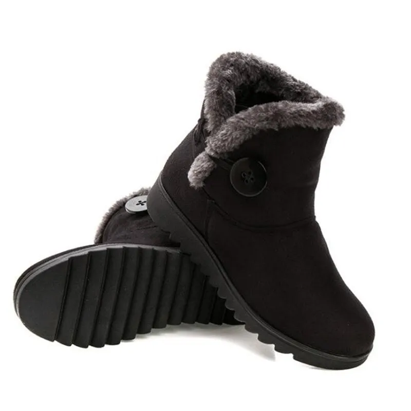Women's winter flock ankle snow boots with button closure, rubber sole, and low platform in solid colour