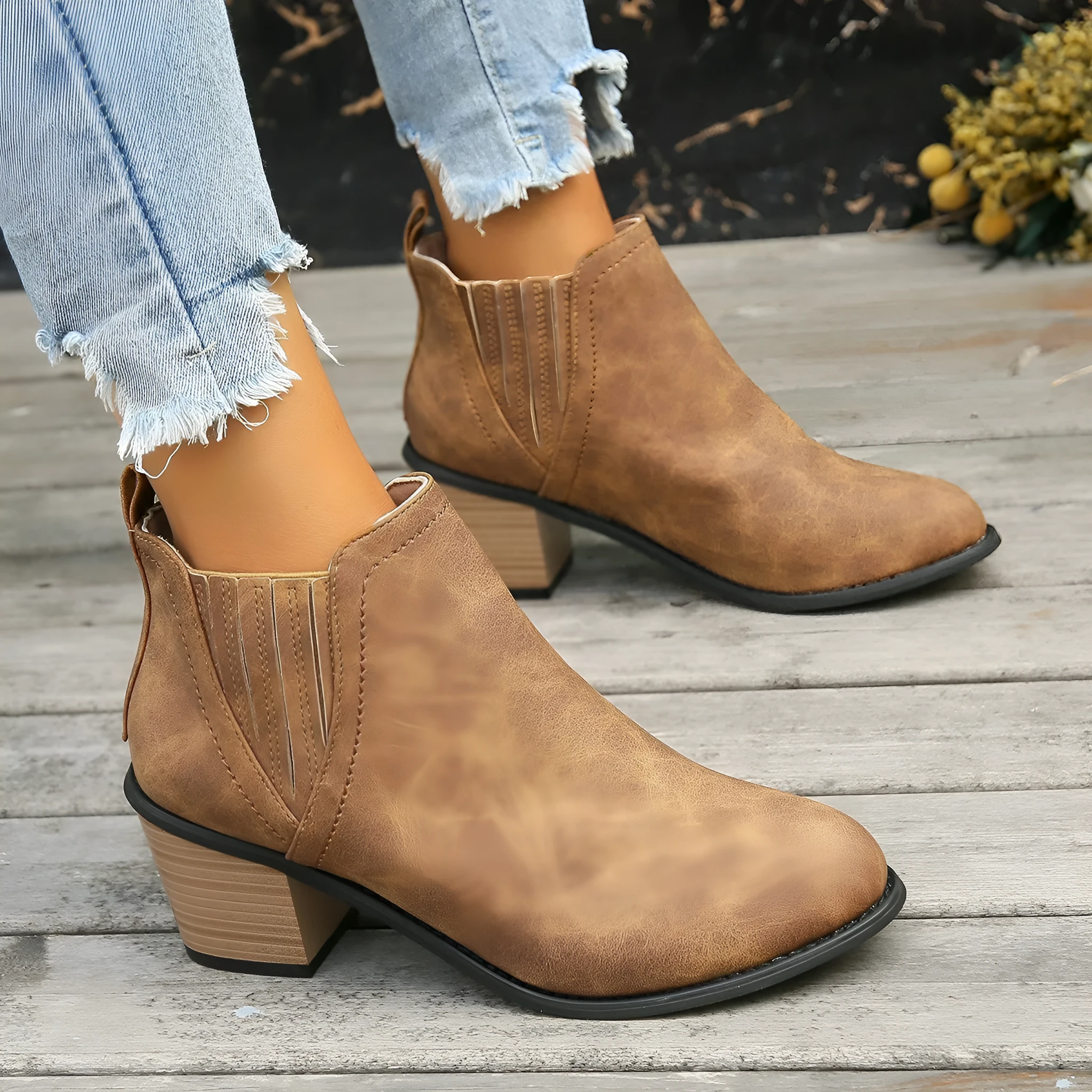 Women's black ankle boots with pointed toe and thick square heel, slip-on design