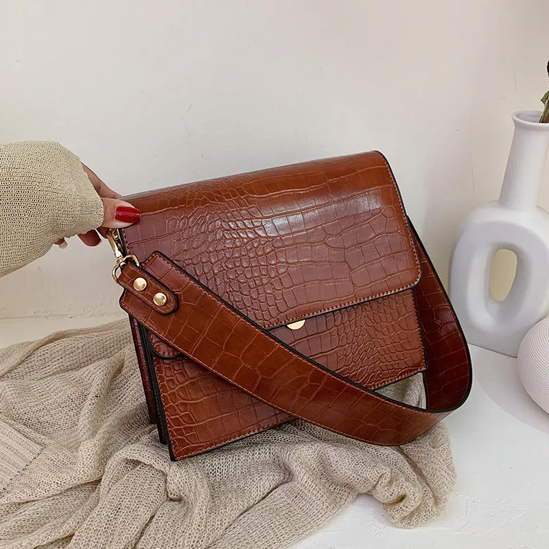 Stone pattern small square PU shoulder bag with flap closure and double straps, shown in blue, black, bronze, and yellow colour options