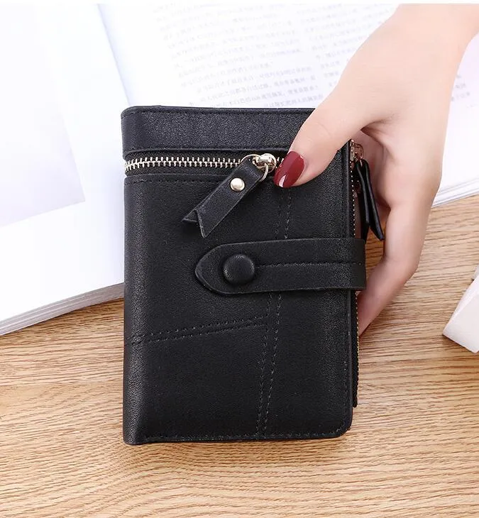 Vegan woman faux leather short wallet with zipper closure in solid colour, showing interior with bill and card compartments