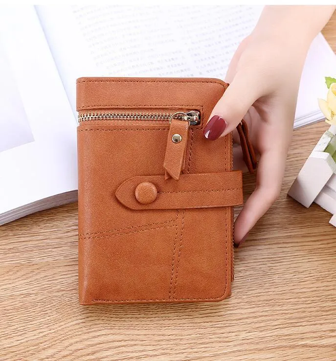 Vegan woman faux leather short wallet with zipper closure in solid colour, showing interior with bill and card compartments