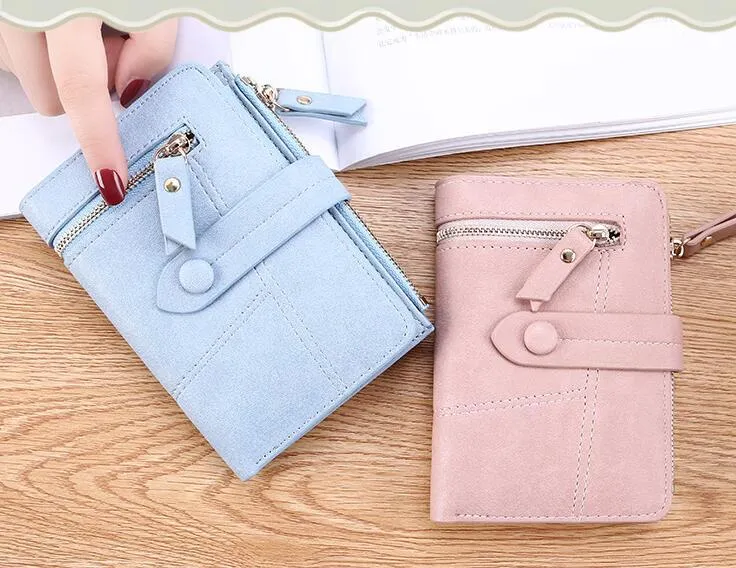 Vegan woman faux leather short wallet with zipper closure in solid colour, showing interior with bill and card compartments