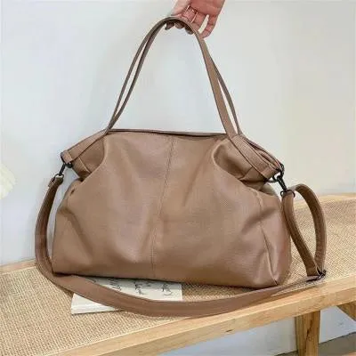 Soft surface PU leather messenger tote bag in a horizontal square shape with an adjustable shoulder strap.
