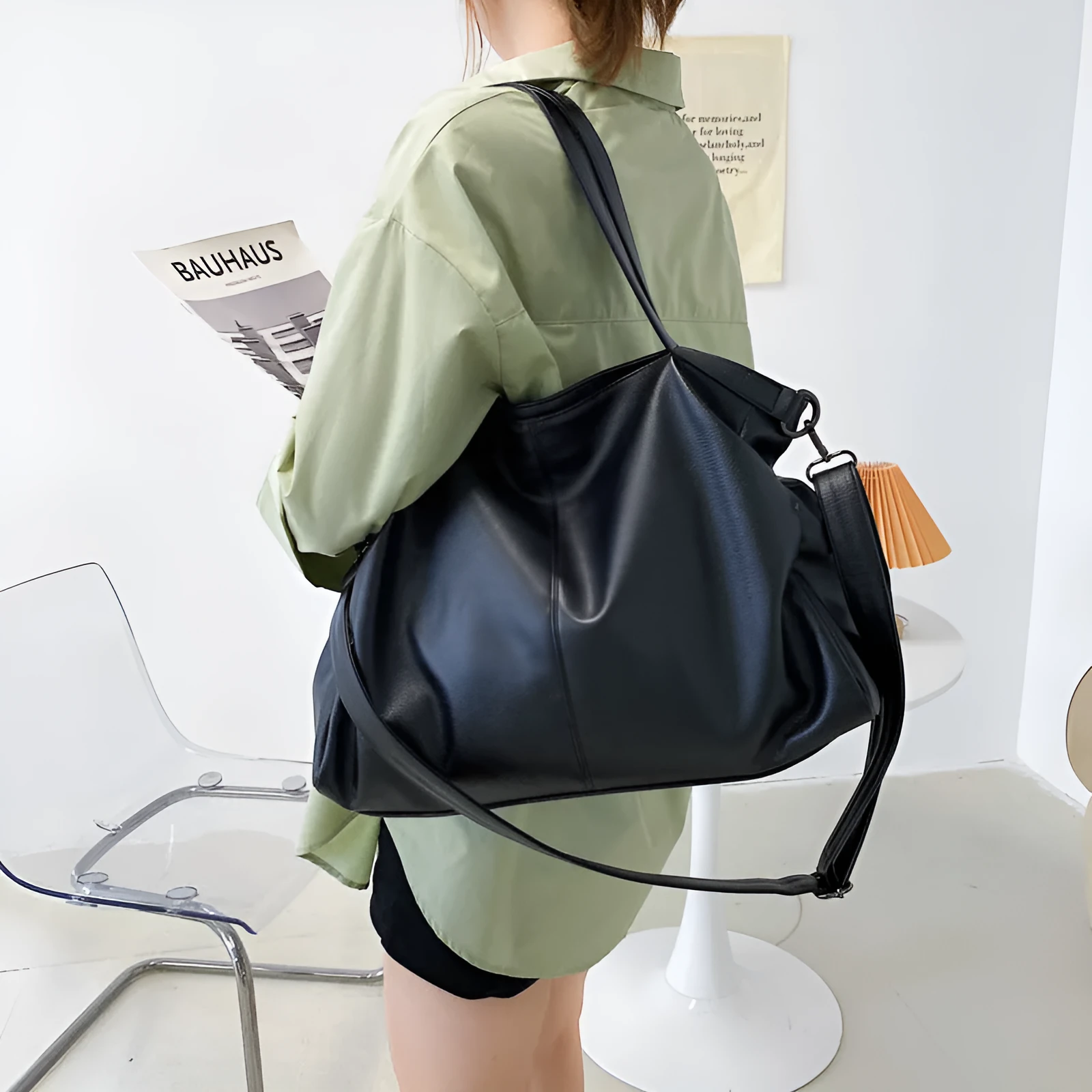 Soft surface PU leather messenger tote bag in a horizontal square shape with an adjustable shoulder strap.