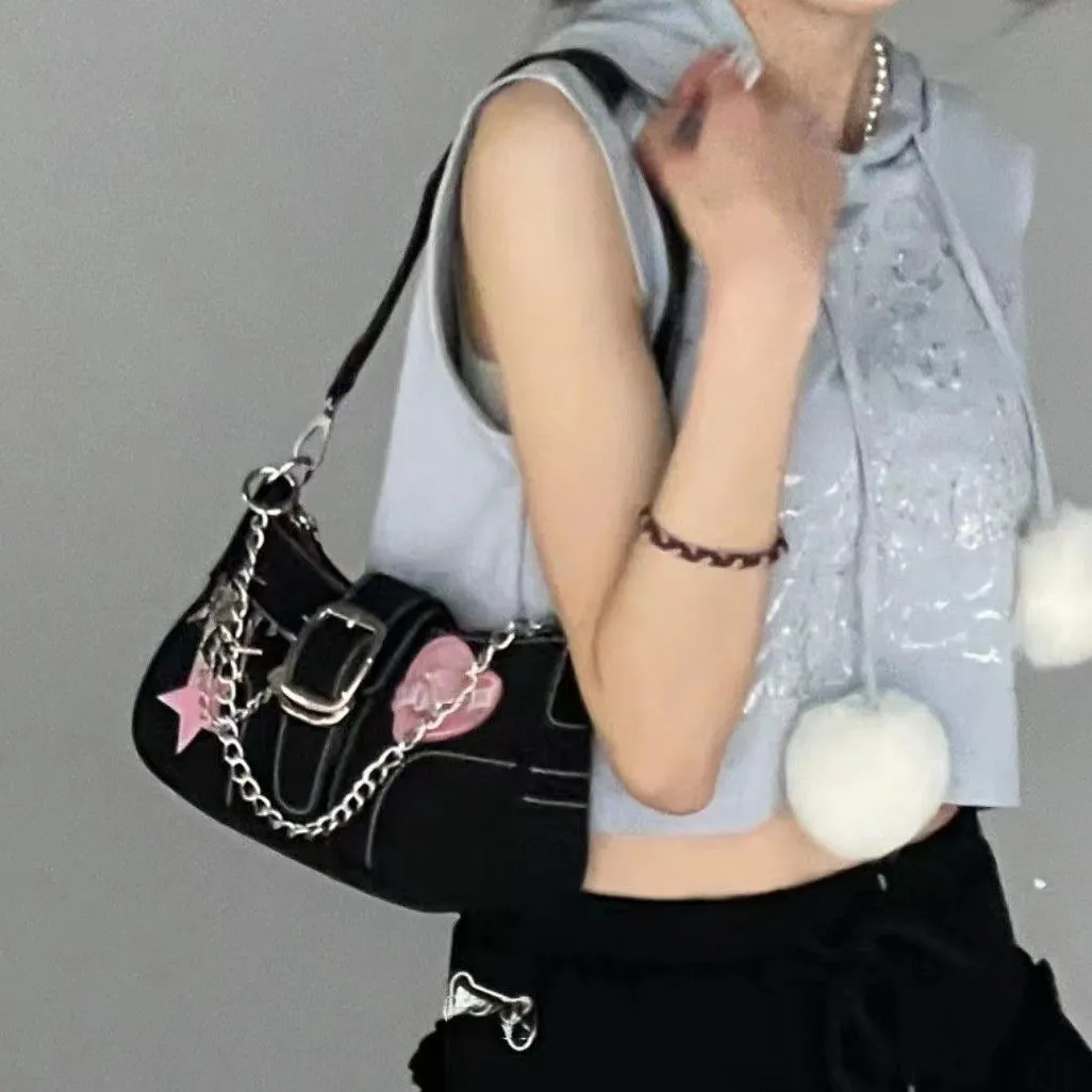 Black PU leather Y2K shoulder bag with heart butterfly shape, bow, stitching, chain, and zipper buckle