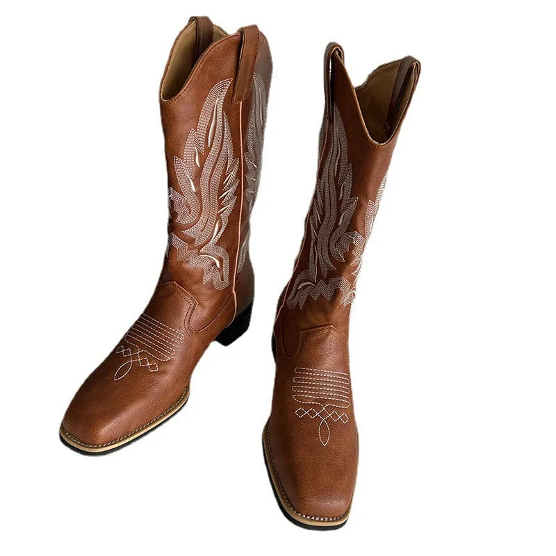 Brown embroidered women's mid-calf Martin boots with a square heel on a white background.