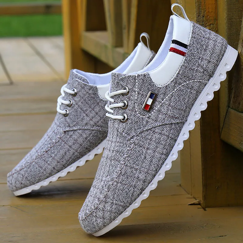 Men's black hemp sailing shoes with grid pattern and car stitch detail on a flat sole