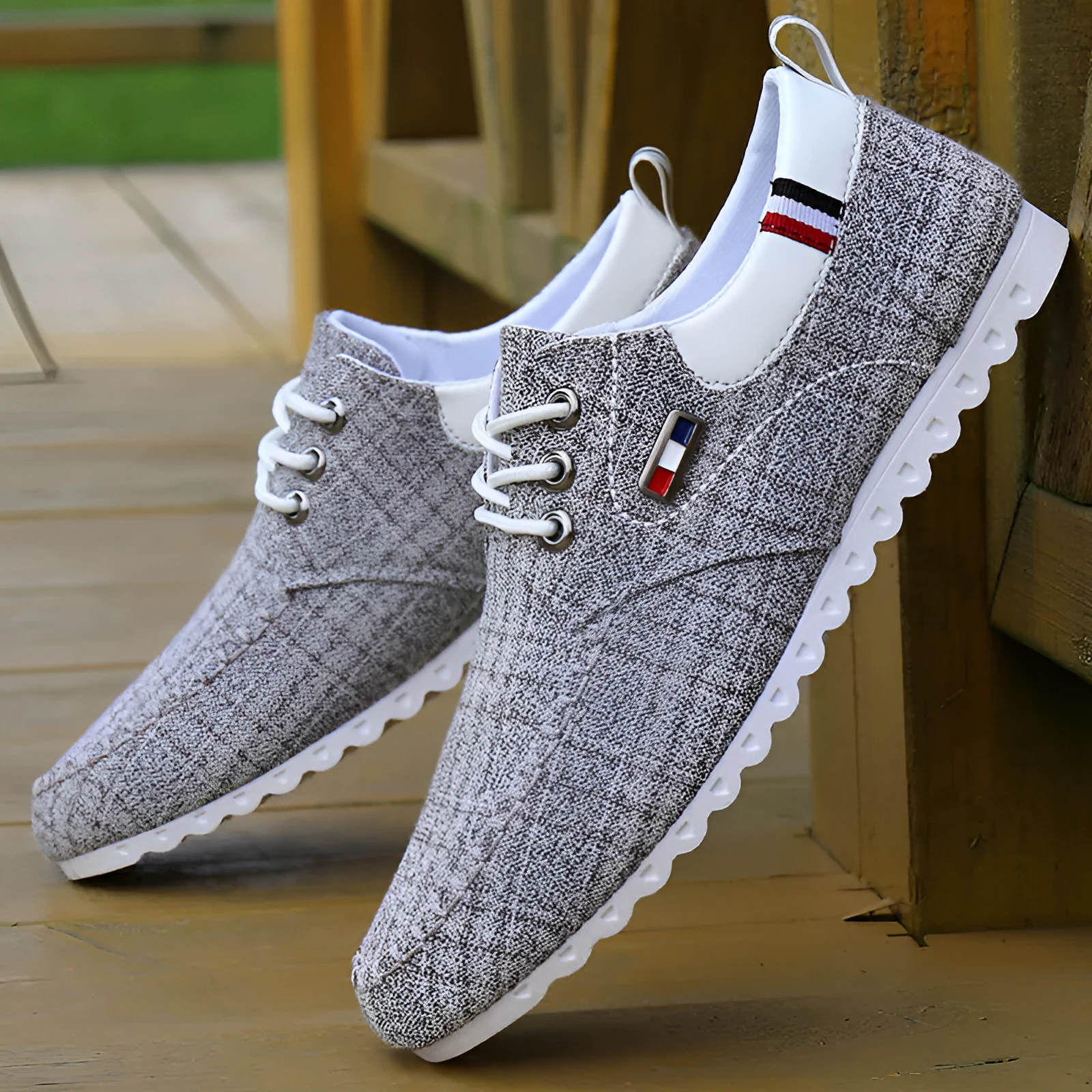 Men's black hemp sailing shoes with grid pattern and car stitch detail on a flat sole