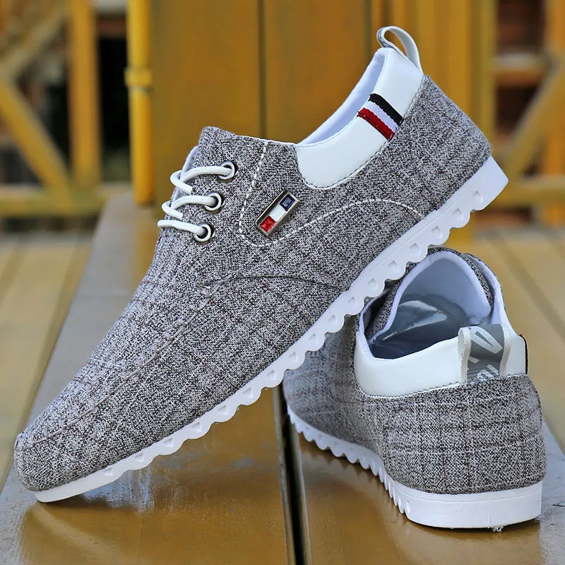 Men's black hemp sailing shoes with grid pattern and car stitch detail on a flat sole