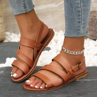 Fashion round toe beige Roman women's sandals with PU upper and rubber sole on a neutral background
