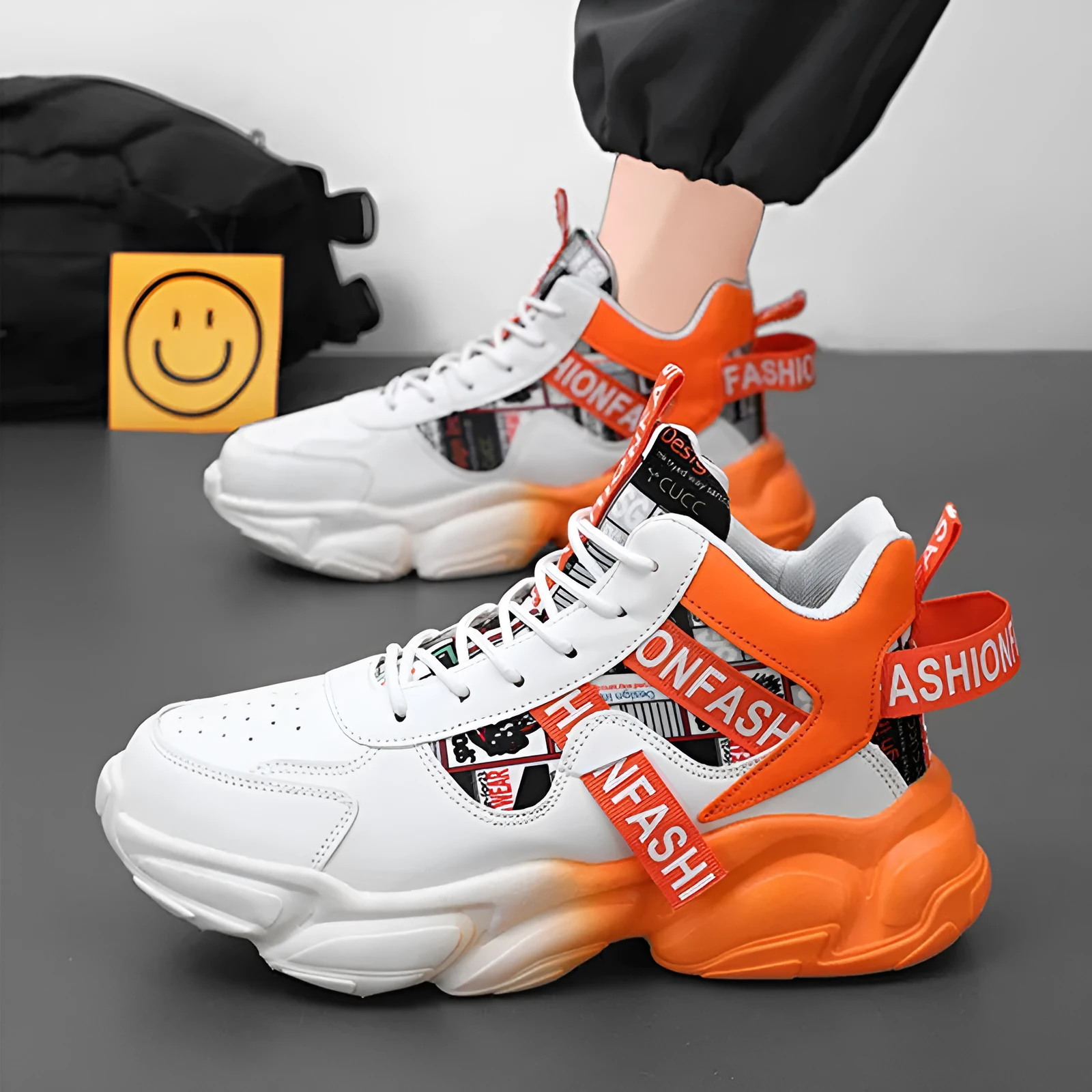 Men's high-top colourblock lace-up casual sneakers in orange with synthetic leather upper and thick rubber sole.